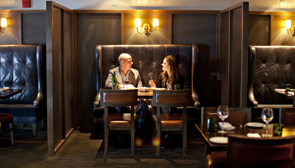Couple sitting in a booth at B&O American Brasserie in Baltimore
